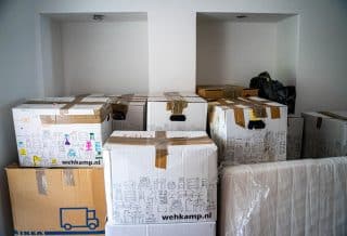 brown cardboard boxes on brown wooden table